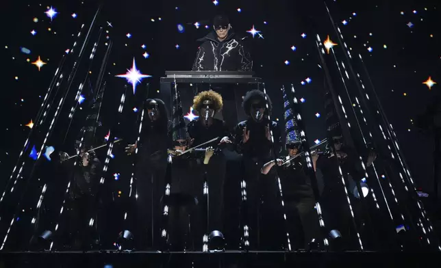 Chris Lowe from the 'Pet Shop Boys' perform alongside the Manchester Camerata during the MTV European Music Awards in Manchester, England, Sunday, Nov. 10, 2024. (Scott A Garfitt/Invision/AP)