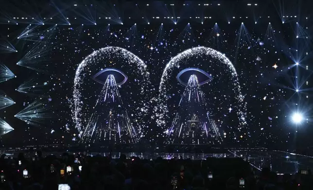 Neil Tennant, left, and Chris Lowe from the 'Pet Shop Boys' perform alongside the Manchester Camerata during the MTV European Music Awards in Manchester, England, Sunday, Nov. 10, 2024. (Scott A Garfitt/Invision/AP)