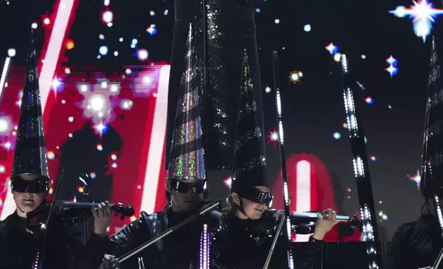 Neil Tennant from the 'Pet Shop Boys' performs alongside the Manchester Camerata during the MTV European Music Awards in Manchester, England, Sunday, Nov. 10, 2024. (Scott A Garfitt/Invision/AP)