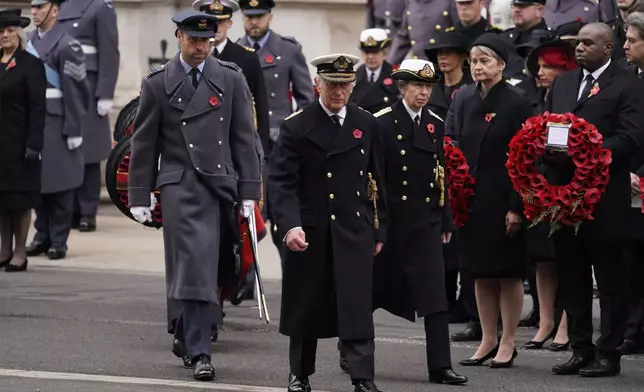 Britain's King Charles III, centre, with Prince William ,left, and Princess Anne attend the Remembrance Sunday Service at the Cenotaph in London, Sunday, Nov. 10, 2024. (AP Photo/Alberto Pezzali, Pool)