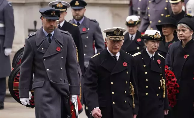 Britain's King Charles III, centre, with Prince William ,left, and Princess Anne attend the Remembrance Sunday Service at the Cenotaph in London, Sunday, Nov. 10, 2024. (AP Photo/Alberto Pezzali, Pool)