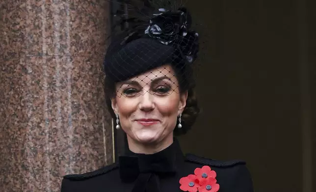 Britain's Kate, Princess of Wales, stands on a balcony during the National Service of Remembrance at The Cenotaph in London, England, Sunday, Nov. 10, 2024. (Toby Melville/Pool Photo via AP)