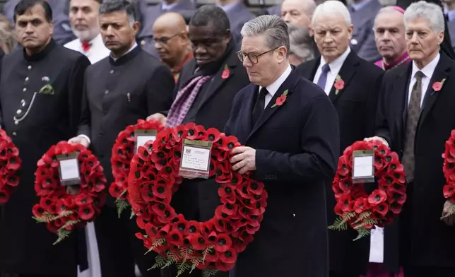 Britain's Prime Minister Keir Starmer lays a wreath during the Remembrance Sunday Service at the Cenotaph in London, Sunday, Nov. 10, 2024. (AP Photo/Alberto Pezzali)