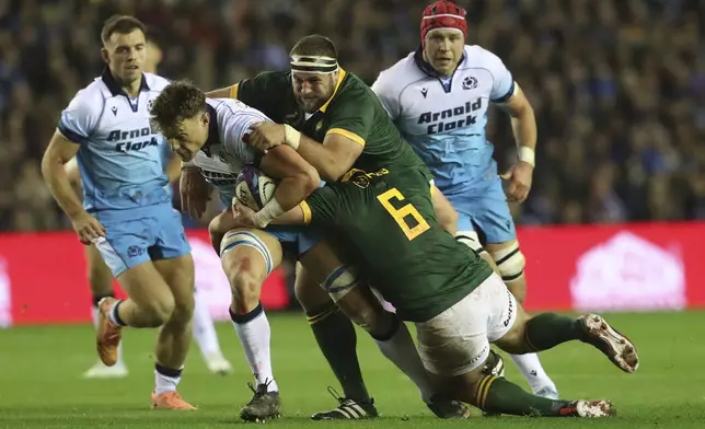 Scotland's Jack Dempsey, is brought down by South Africa's Thomas Du Toit and South Africa's Marco Van Staden during the Autumn Nations series rugby union match between Scotland and South Africa in Edinburgh, Scotland, Sunday, Nov. 10, 2024. (AP Photo/Scott Heppell)