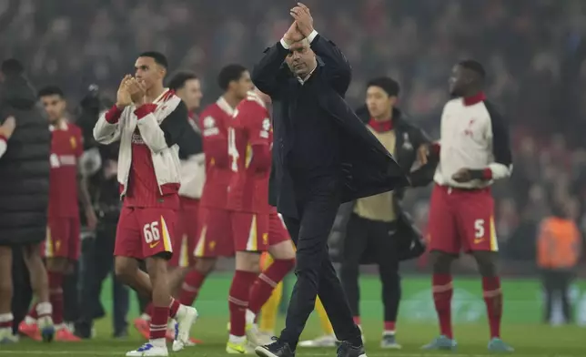 Liverpool's manager Arne Slot applauds the crowd at the end of the Champions League opening phase soccer match between Liverpool and Bayer Leverkusen at Anfield in Liverpool, England, Tuesday, Nov. 5, 2024. (AP Photo/Jon Super)