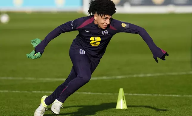 England's Rico Lewis runs during a training session at St George's Park, Burton upon Trent, England, Wednesday Nov. 13, 2024. (Nick Potts/PA via AP)