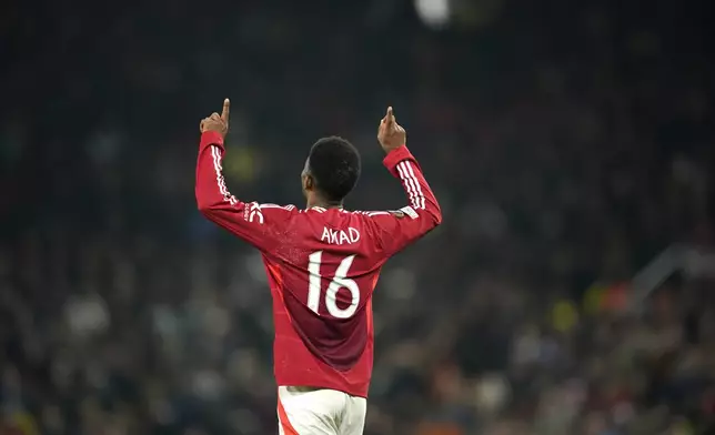 Manchester United's Amad Diallo celebrates after scoring his side's second goal during the Europa League opening phase soccer match between Manchester United and PAOK at the Old Trafford stadium in Manchester, England, Thursday, Nov. 7, 2024. (AP Photo/Dave Thompson)