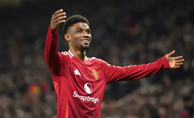 Manchester United's Amad Diallo celebrates after scoring his side's second goal during the Europa League opening phase soccer match between Manchester United and PAOK at the Old Trafford stadium in Manchester, England, Thursday, Nov. 7, 2024. (AP Photo/Dave Thompson)