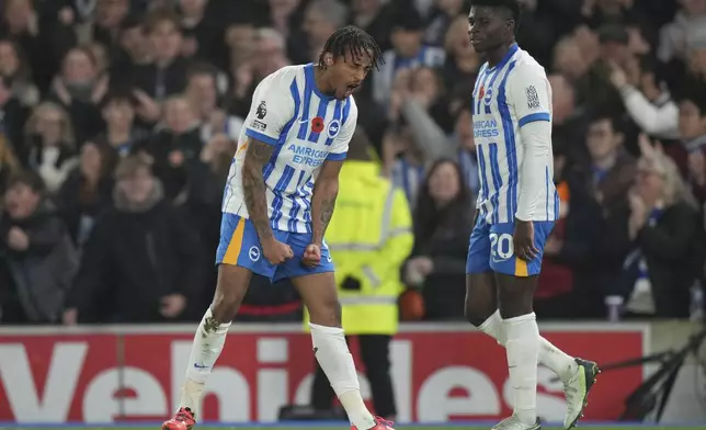 Brighton's Joao Pedro, left, celebrates after scoring during the English Premier League soccer match between Brighton and Manchester City at Falmer Stadium in Brighton, England, Saturday, Nov. 9, 2024. (AP Photo/Alastair Grant)