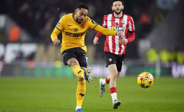 Wolverhampton Wanderers' Matheus Cunha scoring his sides second goal during the British Premier League soccer match between Wolverhampton Wanderers and Southampton, at Molineux, Wolverhampton, England, Saturday Nov. 9, 2024. (Nick Potts/PA via AP)