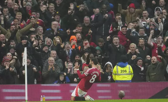 Manchester United's Bruno Fernandes celebrates after scoring his side's first goal during the English Premier League soccer match between Manchester United and Leicester City, at the Old Trafford stadium in Manchester, England, Sunday, Nov.10, 2024. (AP Photo/Jon Super)