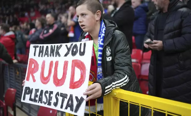 Manchester United supporter holds a banner reading 'Thank you Ruud, please stay' during the English Premier League soccer match between Manchester United and Leicester City, at the Old Trafford stadium in Manchester, England, Sunday, Nov.10, 2024. (AP Photo/Jon Super)