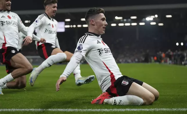 Fulham's Harry Wilson celebrates after scoring his sides second goal during the English Premier League soccer match between Fulham and Brentford at Craven Cottage stadium in London, Monday, Nov. 4, 2024. (AP Photo/Frank Augstein)