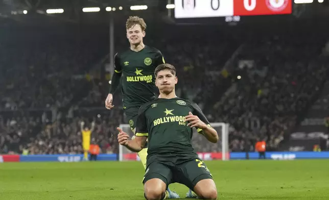 Brentford's Vitaly Janelt celebrates after scoring the opening goal of the game during the English Premier League soccer match between Fulham and Brentford at Craven Cottage stadium in London, Monday, Nov. 4, 2024. (AP Photo/Frank Augstein)