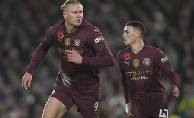 Manchester City's Erling Haaland celebrates after scoring during the English Premier League soccer match between Brighton and Manchester City at Falmer Stadium in Brighton, England, Saturday, Nov. 9, 2024. (AP Photo/Alastair Grant)