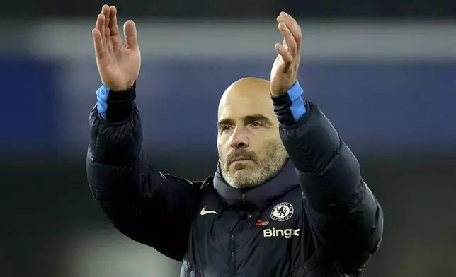 Chelsea's head coach Enzo Maresca applauds at the end of the English Premier League soccer match between Chelsea and Arsenal at Stamford Bridge stadium in London, Sunday, Nov. 10, 2021. (AP Photo/Kirsty Wigglesworth)