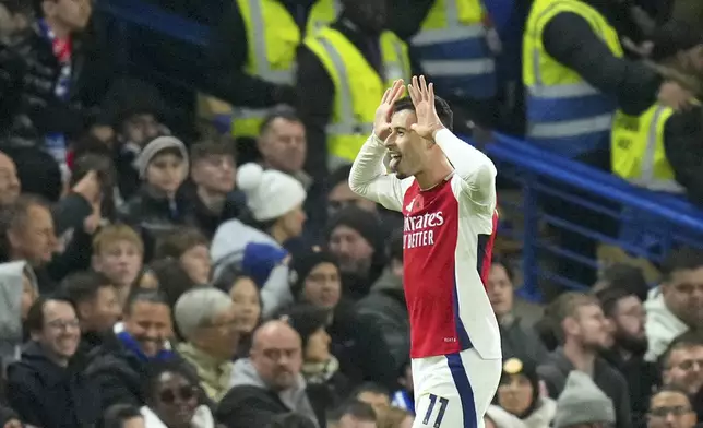 Arsenal's Gabriel Martinelli celebrates after scoring the opening goal during the English Premier League soccer match between Chelsea and Arsenal at Stamford Bridge stadium in London, Sunday, Nov. 10, 2021. (AP Photo/Kirsty Wigglesworth)