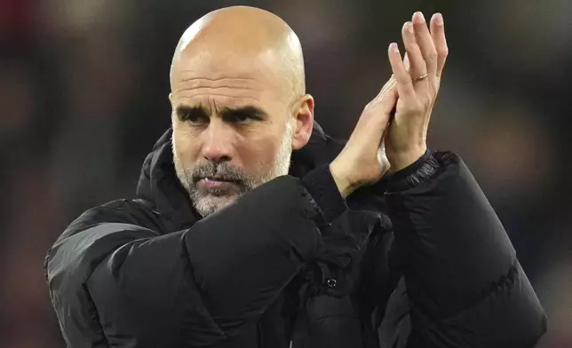 Manchester City's head coach Pep Guardiola applauds his sides fans after the end of the English Premier League soccer match between Bournemouth and Manchester City at the Vitality stadium in Bournemouth, England, Saturday, Nov. 2, 2024 Bournemouth won the game 2-1. (AP Photo/Kirsty Wigglesworth)