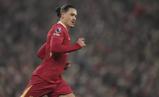 Liverpool's Darwin Nunez runs for a ball during the English Premier League soccer match against Aston Villa at the Anfield stadium in Liverpool, Saturday, Nov. 9, 2024. (AP Photo/Jon Super)