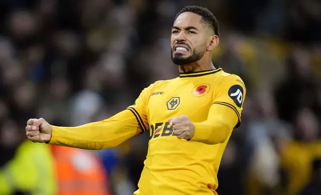 Wolverhampton Wanderers' Matheus Cunha celebrates scoring his side's second goal during the British Premier League soccer match between Wolverhampton Wanderers and Southampton, at Molineux, Wolverhampton, England, Saturday Nov. 9, 2024. (Nick Potts/PA via AP)