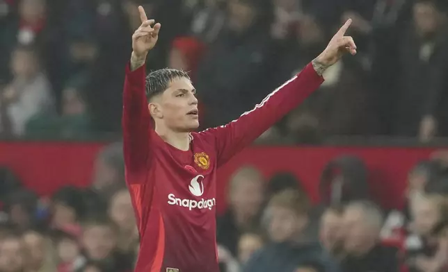 Manchester United's Alejandro Garnacho celebrates after scoring his side's third goal during the English Premier League soccer match between Manchester United and Leicester City, at the Old Trafford stadium in Manchester, England, Sunday, Nov.10, 2024. (AP Photo/Jon Super)