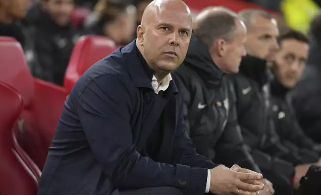 Liverpool's manager Arne Slot waits for the beginning the English Premier League soccer match against Aston Villa at the Anfield stadium in Liverpool, Saturday, Nov. 9, 2024. (AP Photo/Jon Super)