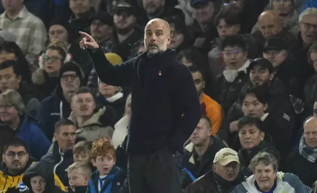 Manchester City's head coach Pep Guardiola reacts during the English Premier League soccer match between Brighton and Manchester City at Falmer Stadium in Brighton, England, Saturday, Nov. 9, 2024. (AP Photo/Alastair Grant)