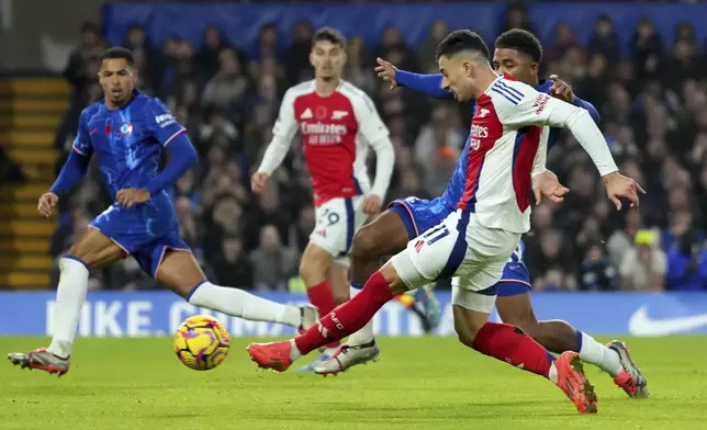 Arsenal's Gabriel Martinelli attempts a shot at goal during the English Premier League soccer match between Chelsea and Arsenal at Stamford Bridge stadium in London, Sunday, Nov. 10, 2021. (AP Photo/Kirsty Wigglesworth)