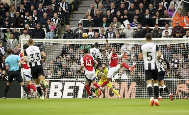 Newcastle United's Alexander Isak scores his side's first goal of the game, during the English Premier League soccer match between Newcastle United and Arsenal, at St James' Park, in Newcastle, England, Saturday, Nov. 2, 2024. (Owen Humphreys/PA via AP)