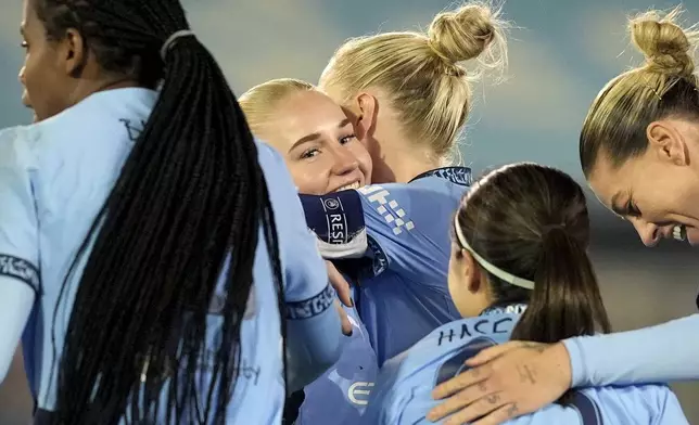 Manchester City's Laura Blindkilde, center, celebrates after scoring the opening goal during the women's Champions League soccer match between Manchester City FC and Hammarby IF in Manchester, England, Tuesday, Nov. 12, 2024. (Martin Rickett/PA via AP)