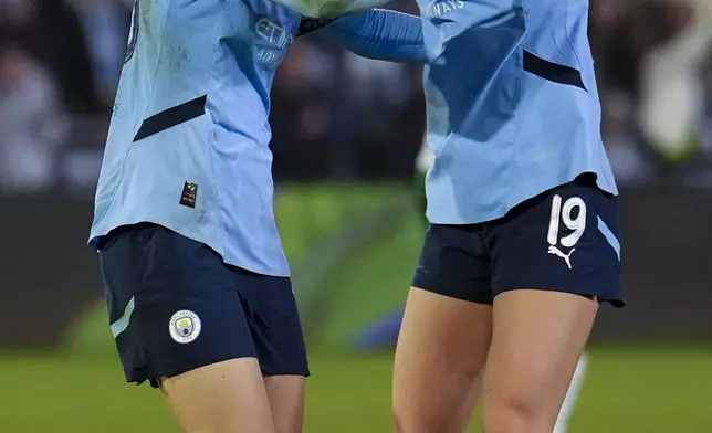 Manchester City's Aoba Fujino, left, celebrates after scoring her side's second goal during the women's Champions League soccer match between Manchester City FC and Hammarby IF in Manchester, England, Tuesday, Nov. 12, 2024. (Martin Rickett/PA via AP)