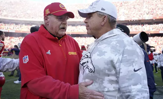 Kansas City Chiefs head coach Andy Reid, left, and Denver Broncos head coach Sean Payton talk following an NFL football game Sunday, Nov. 10, 2024, in Kansas City, Mo. The Chiefs won 16-14. (AP Photo/Ed Zurga)