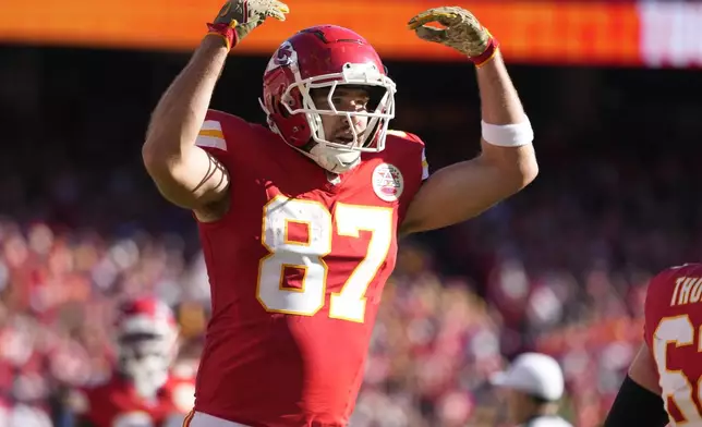 Kansas City Chiefs tight end Travis Kelce (87) celebrates after catching a touchdown pass during the first half of an NFL football game against the Denver Broncos Sunday, Nov. 10, 2024, in Kansas City, Mo. (AP Photo/Ed Zurga)