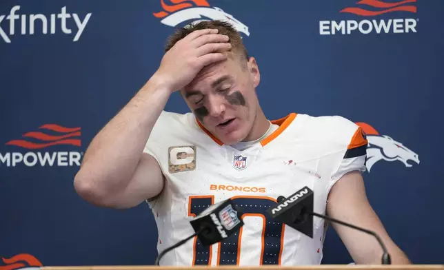 Denver Broncos quarterback Bo Nix pauses during a news conference following an NFL football game against the Kansas City Chiefs Sunday, Nov. 10, 2024, in Kansas City, Mo. The Chiefs won 16-14. (AP Photo/Ed Zurga)