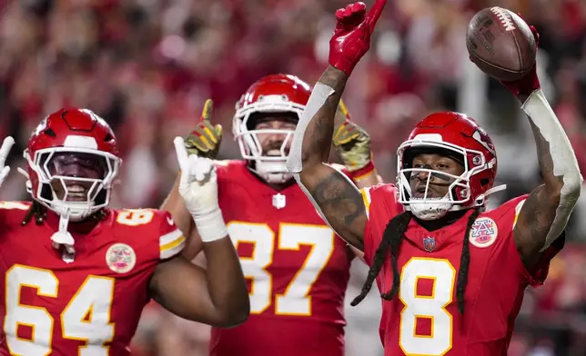 Kansas City Chiefs wide receiver DeAndre Hopkins (8) celebrates his touchdown in the end zone against the Tampa Bay Buccaneers during the first half of an NFL football game, Monday, Nov. 4, 2024, in Kansas City, Mo. (AP Photo/Ed Zurga)