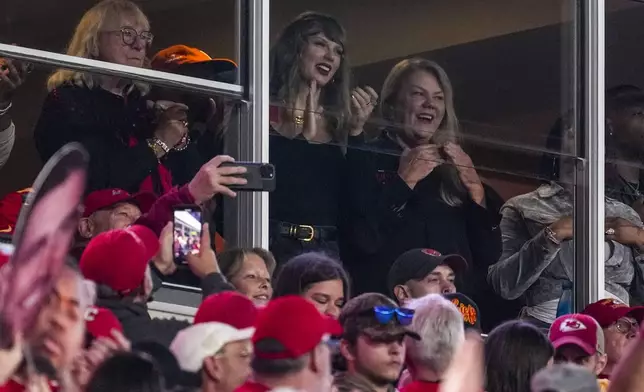 Taylor Swift, top center, watches play during the first half of an NFL football game between the Kansas City Chiefs and the Tampa Bay Buccaneers, Monday, Nov. 4, 2024, in Kansas City, Mo. (AP Photo/Ed Zurga)