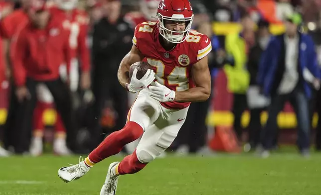 Kansas City Chiefs wide receiver Justin Watson (84) runs after a catch Tampa Bay Buccaneers during the first half of an NFL football game, Monday, Nov. 4, 2024, in Kansas City, Mo. (AP Photo/Charlie Riedel)