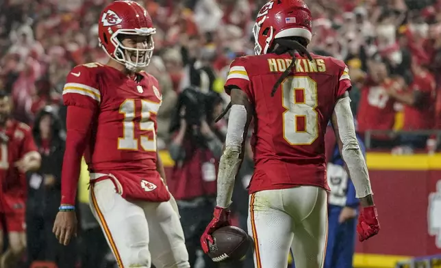 Kansas City Chiefs wide receiver DeAndre Hopkins (8) celebrates his touchdown with quarterback Patrick Mahomes (15) during the second half of an NFL football game against the Tampa Bay Buccaneers, Monday, Nov. 4, 2024, in Kansas City, Mo. (AP Photo/Ed Zurga)