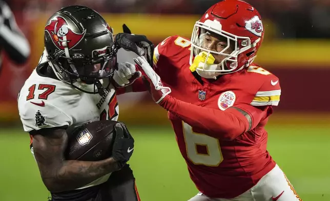 Tampa Bay Buccaneers wide receiver Sterling Shepard (17) runs against Kansas City Chiefs safety Bryan Cook (6) during the first half of an NFL football game, Monday, Nov. 4, 2024, in Kansas City, Mo. (AP Photo/Charlie Riedel)