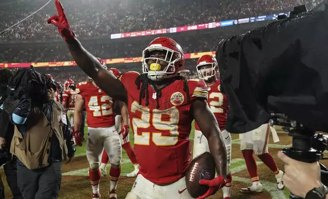 Kansas City Chiefs running back Kareem Hunt (29) celebrates a win over the Tampa Bay Buccaneers in overtime of an NFL football game, Monday, Nov. 4, 2024, in Kansas City, Mo. (AP Photo/Ed Zurga)