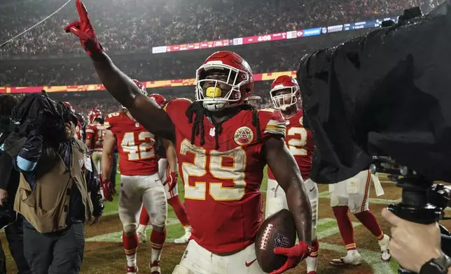 Kansas City Chiefs running back Kareem Hunt (29) celbrates a win over the Tampa Bay Buccaneers in overtime of an NFL football game, Monday, Nov. 4, 2024, in Kansas City, Mo. (AP Photo/Ed Zurga)