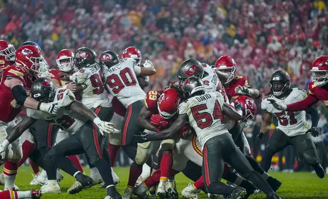 Kansas City Chiefs running back Kareem Hunt (29) runs into the end zone for a touchdown against the Tampa Bay Buccaneers during overtime of an NFL football game, Monday, Nov. 4, 2024, in Kansas City, Mo. (AP Photo/Ed Zurga)