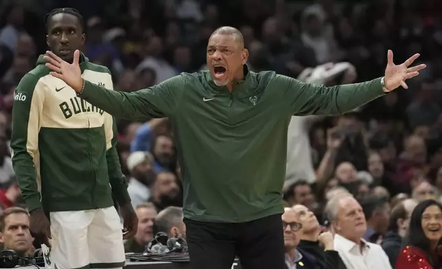 Milwaukee Bucks head coach Doc Rivers shouts to an official in the first half of an NBA basketball game against the Cleveland Cavaliers, Monday, Nov. 4, 2024, in Cleveland. (AP Photo/Sue Ogrocki)