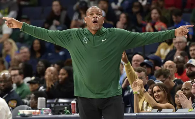 Milwaukee Bucks head coach Doc Rivers calls to players in the first half of an NBA basketball game against the Memphis Grizzlies Thursday, Oct. 31, 2024, in Memphis, Tenn. (AP Photo/Brandon Dill)