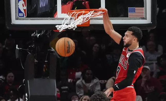 Chicago Bulls guard Zach LaVine scores against the Atlanta Hawks during the second half of an NBA basketball game Saturday, Nov. 9, 2024, in Atlanta. (AP Photo/John Bazemore)