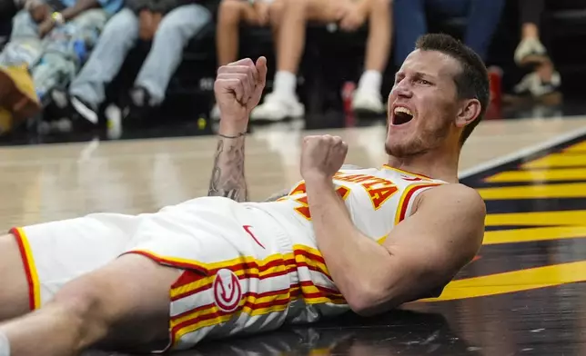 Atlanta Hawks guard Garrison Mathews (24) reacts after being fouled during the second half of an NBA basketball game against the Chicago Bulls Saturday, Nov. 9, 2024, in Atlanta. (AP Photo/ John Bazemore)