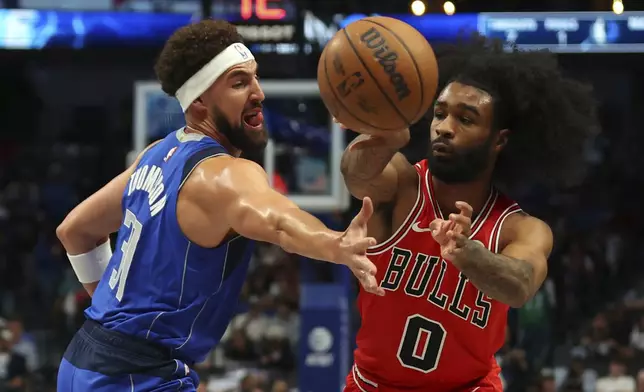 Dallas Mavericks guard Klay Thompson (31) defends as Chicago Bulls' Coby White (0) passes the ball in the first half of an NBA basketball game Wednesday, Nov. 6, 2024, in Dallas. (AP Photo/Richard W. Rodriguez)