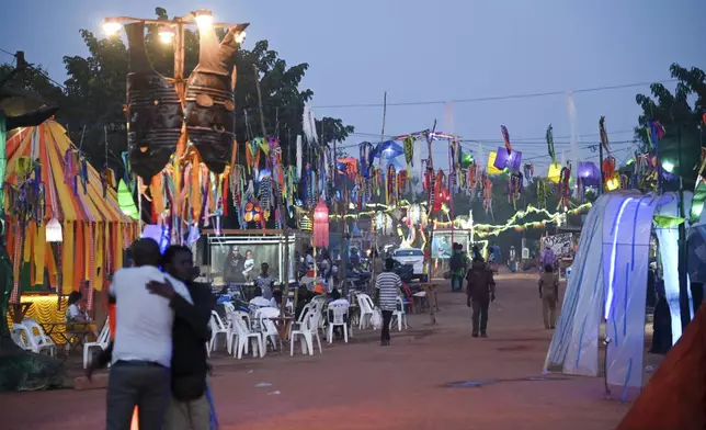 People gather for Recreatrales, an international theater festival held in Ouagadougou, Burkina Faso, Monday, Oct. 28, 2024. (AP Photo/Kilaye Bationo)