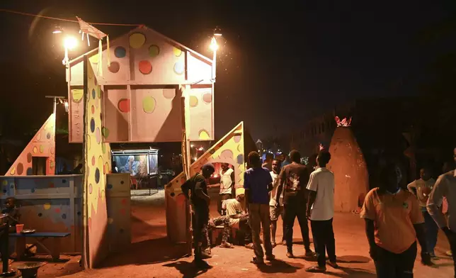 People gather for Recreatrales, an international theater festival held in Ouagadougou, Burkina Faso, Monday, Oct. 28, 2024. (AP Photo/Kilaye Bationo)