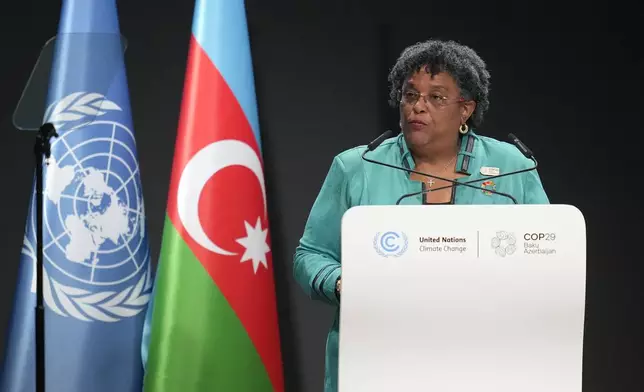 Barbados Prime Minister Mia Mottley speaks during a plenary session at the COP29 U.N. Climate Summit, Tuesday, Nov. 12, 2024, in Baku, Azerbaijan. (AP Photo/Rafiq Maqbool)